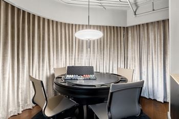 Poker table room with modern pendant lighting